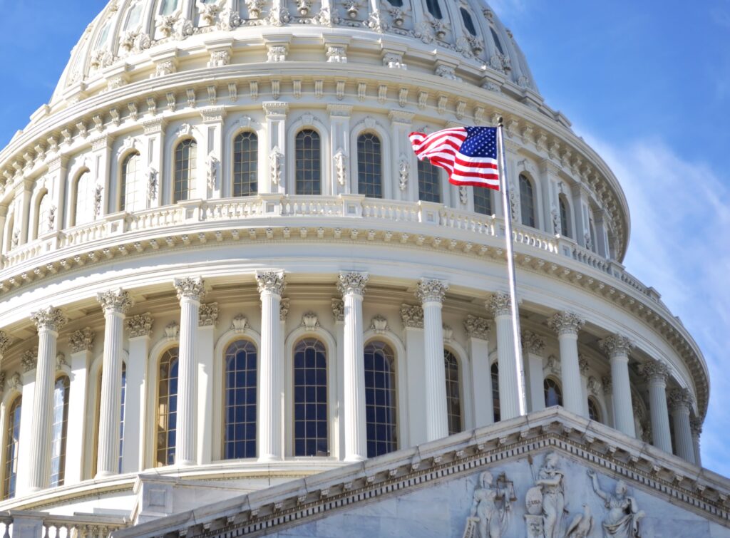 Close-up of US capital building with American flag